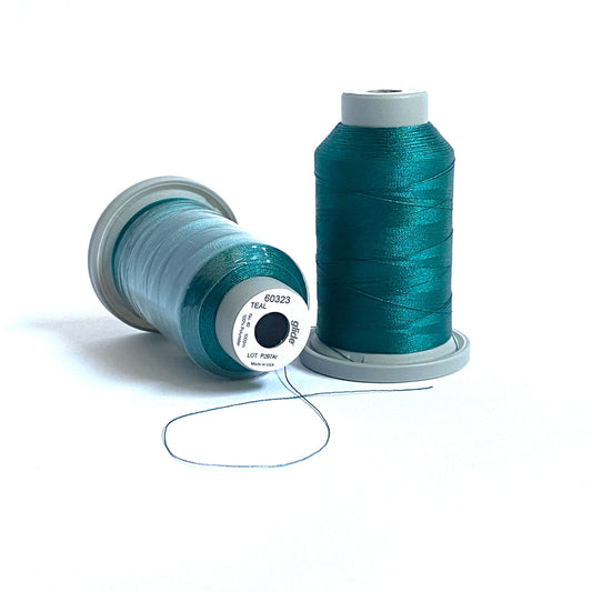 Glide 40 wt. Trilobal polyester thread by Fil-Tec offers exquisite coverage in each 1,100 yard mini spool. Teal (60323) is a dark teal that is perfect for underwater accents or other thread-painting or embroidery projects. Stitcher's Joy