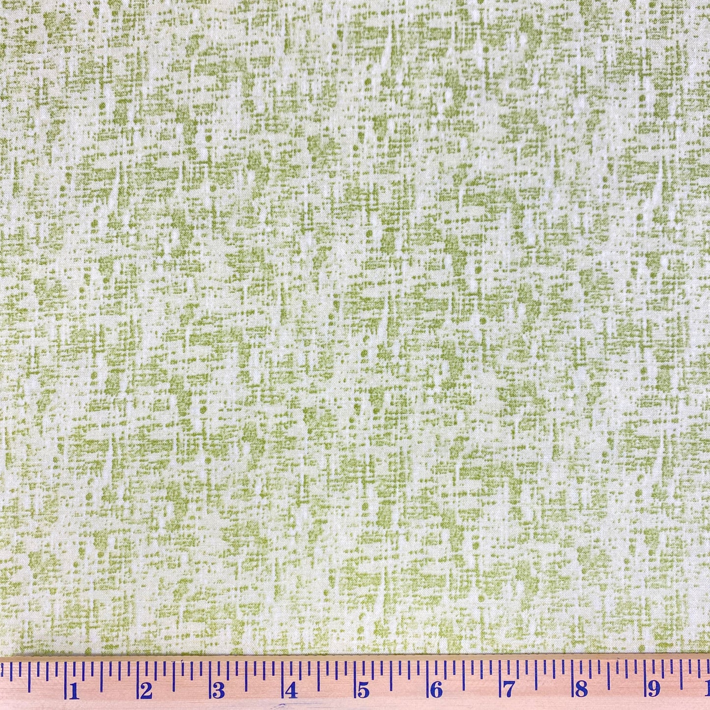 Grunge Plaid in Spring Green is from the Quilter's Cupboard collection designed by Karen Combs for Riverwood Fabrics. It features medium green cross-hatching in a grunge pattern, and is perfect for adding color without a bold or saturated print.