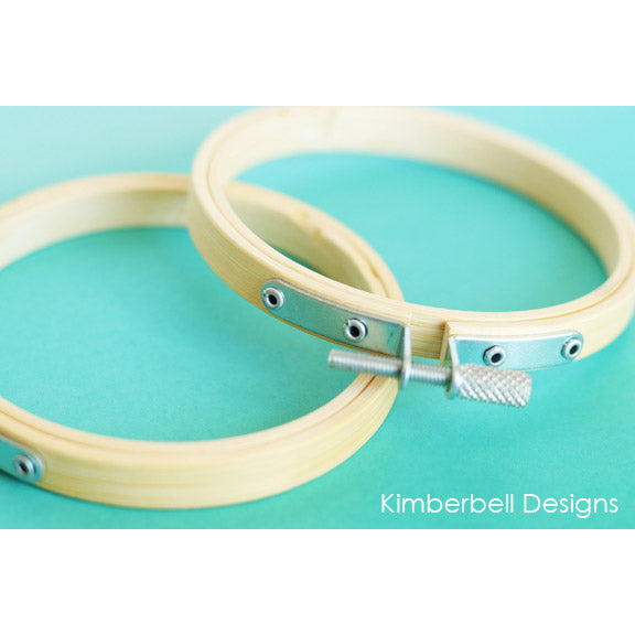 Create darling ornaments, wall hanging, and crafts with Kimberbell Bamboo Hoops (KDKB149). Picture shows a set of 2 – 3 1/2″ diameter hoops out of the package.
