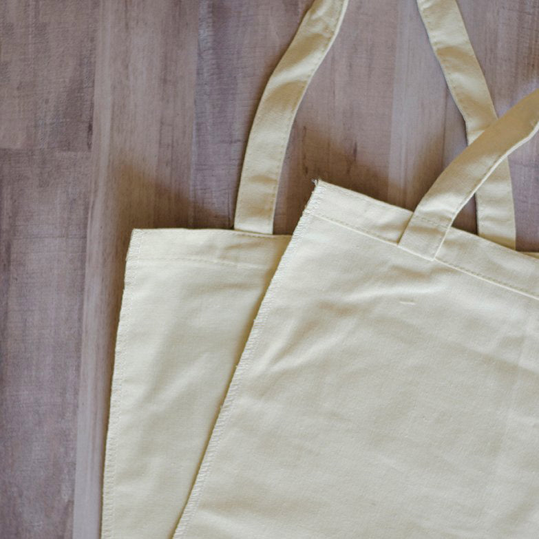 Kimberbell’s blank canvas totes (KDKB202) come without the side seams sewn up so it’s easy to hoop the bag itself, then add the adorable embroidery. The edges are serged too, so the bag won’t fray when you finish the side seams with a simple straight stitch.