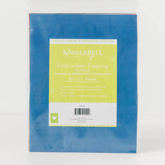 Embroidery Topping (KDST129) by Kimberbell prevents stitches from sinking into the nap of fabrics, such as terrycloth and minkee. Available in a 8 count package of 8 1/2" x 11" sheets, includes colors white, black, grey, red, blue, and yellow.