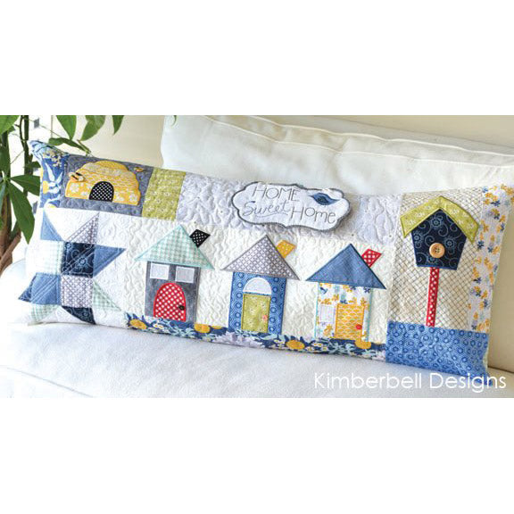 This Home Sweet Home Bench Pillow for Machine Embroidery (KD525) by Kimberbell is the perfect accent for your home. Photo features the completed bench pillow.