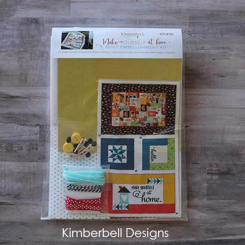 In the Kimberbell Make Yourself at Home Embellishment Kit (KDKB155), we gathered all the homey details to complete your quilt. In this amazing kit, you will feel right as home as you stuff and quilt pillows, and the exclusive Mini Hello Sunshine quilt to hang from the trees. Delight in the details of polka dot glitter lamp shades, mylar light posts, vinyl windows, and dimensional ribbon flowers.