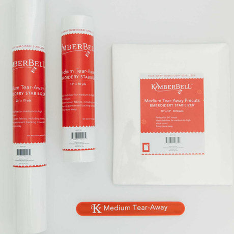 The Medium Tear Away stabilizer by Kimberbell is color-coded in a red to reflect that this tear away will tear away neatly and cleanly with medium to high stitch count designs. Each of the three sizes: 12" x 10 yard, 20" x 10 yard, and 10" x 12" sheets are shown with the coordinating slap band in red to keep the stabilizers organized and identifiable.