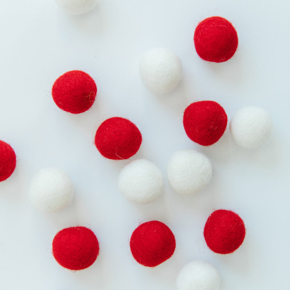 Add a dimensional pop to machine embroidery, sewing, and crafting projects with Kimberbell’s Red & White Wool Felt Balls (KDKB1239) ! Colors include Creamy White and Cherry Red, with 16 one-inch balls per tube. 