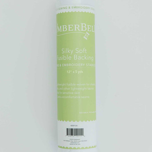 Silky Soft Fusible Backing (KDST125) by Kimberbell is color-coded in green to show it isa specialty stabilizer. It is a lightweight fusible woven for sheers, silks, and other lightweight fabrics to cover uncomfortable seams and for sensitive skin.  It is available in a 12" x 5 yard roll. Stitcher’s Joy