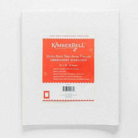 Kimberbell Sticky Back Tear Away stabilizer by Kimberbell is color-coded in a light red to reflect this is a medium weight tear away with light adhesive coating for use on hard to hoop items or with tightly woven, non-stretchable and slippery fabrics. The 10" x 12" sheets are pictured, but the stabilizer is also available in 12" x 10 yard and 20” x 5 yard rolls. 