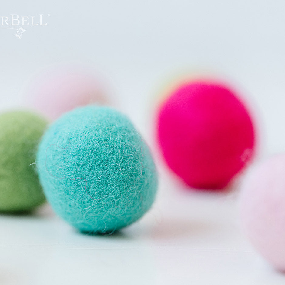 Kimberbell’s Sugar Plum Jubilee Wool Felt Balls (KDKB1214) add a dimensional pop to a variety of machine embroidery, sewing, and craft projects! Colors include Pistachio, Hawaiian Ice, Cherry Cordial, Gumdrop, Key Lime, and Taffy, with two 1.25” balls per color. 