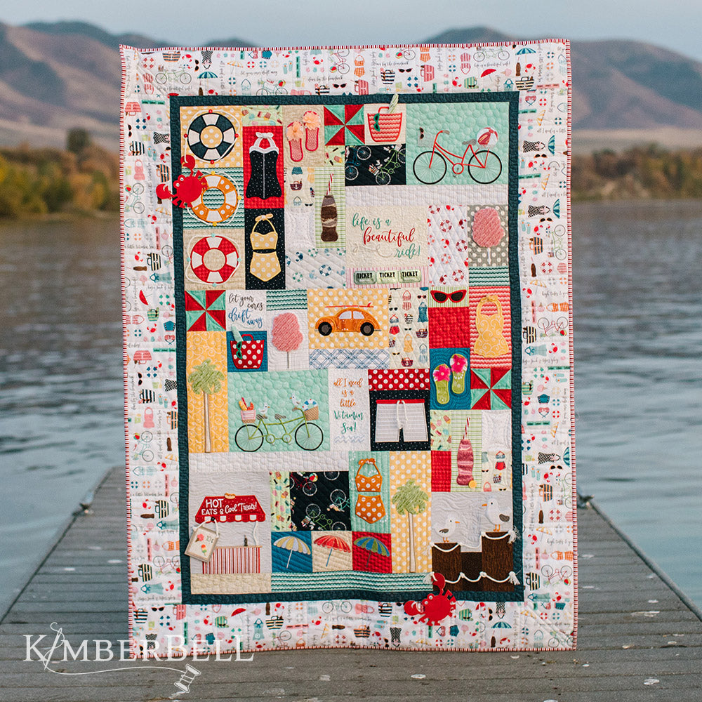 Take a leisurely stroll along a Vintage Boardwalk (KD807) with Kimberbell. This feature quilt is over 32 blocks of seaside resorts of classic cars, tandem bikes, ‘50s-style bathing suits and more. This photo features the entire quilt.