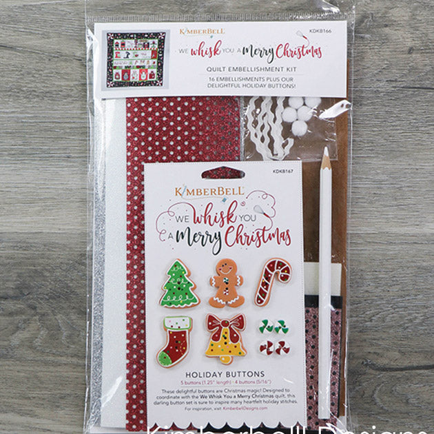 We’ve gathered all the trimmings to complete your We Whisk You a Merry Christmas Quilt in the We Whisk You a Merry Christmas Embellishment Kit (KDKB166). Our delightful embellishment kit is a joy to unwrap, with clear vinyl and applique glitter, designer holiday buttons, marshmallow poms, chalk fabric, and more! Photo shows the front of the package.